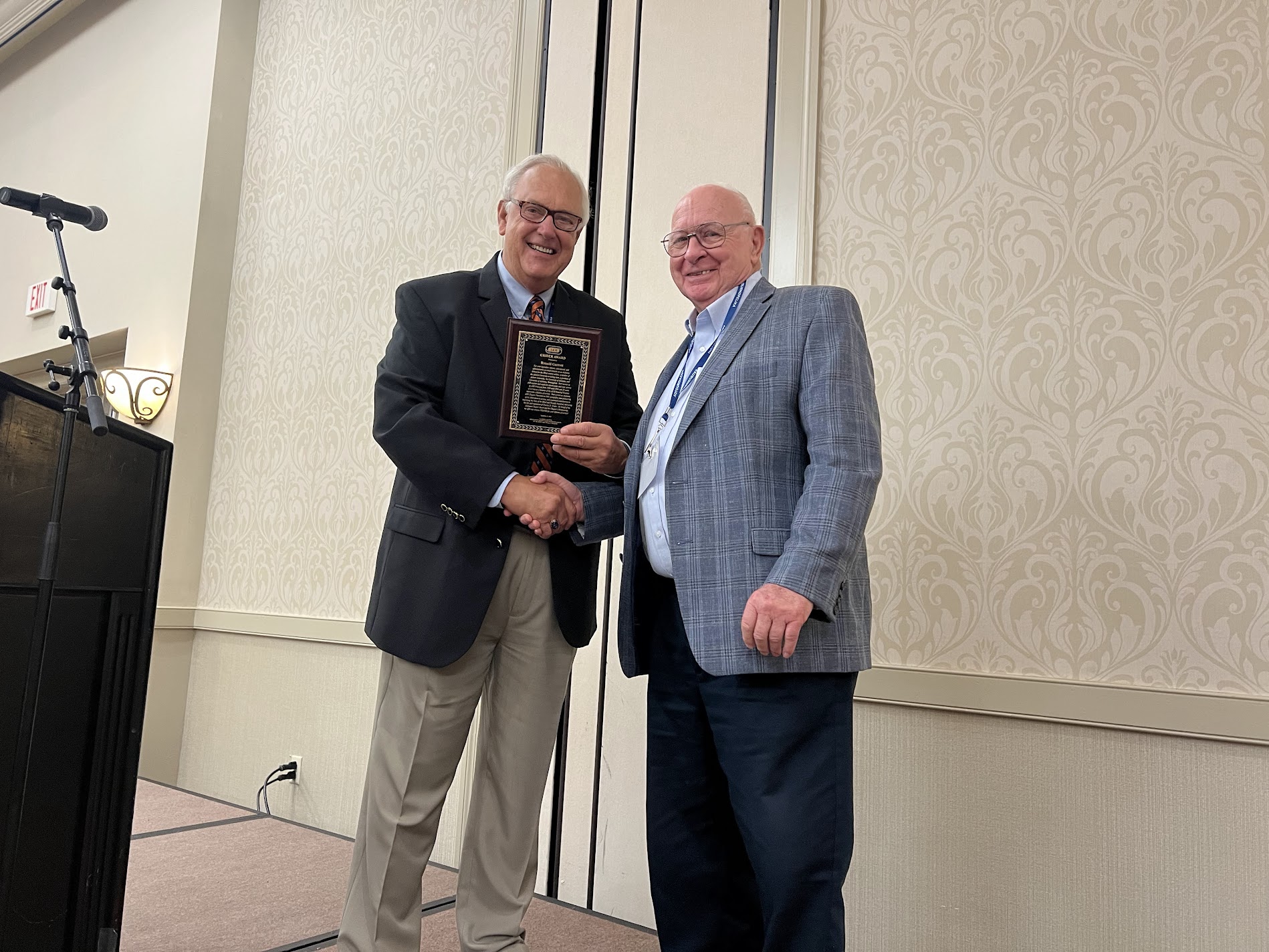 Joe Helm presents Mr. Garrett the Charles B. Grider Award